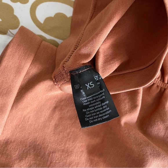 Alphalete Amplify Short in Mandarin (XS) - Picture 2 of 2